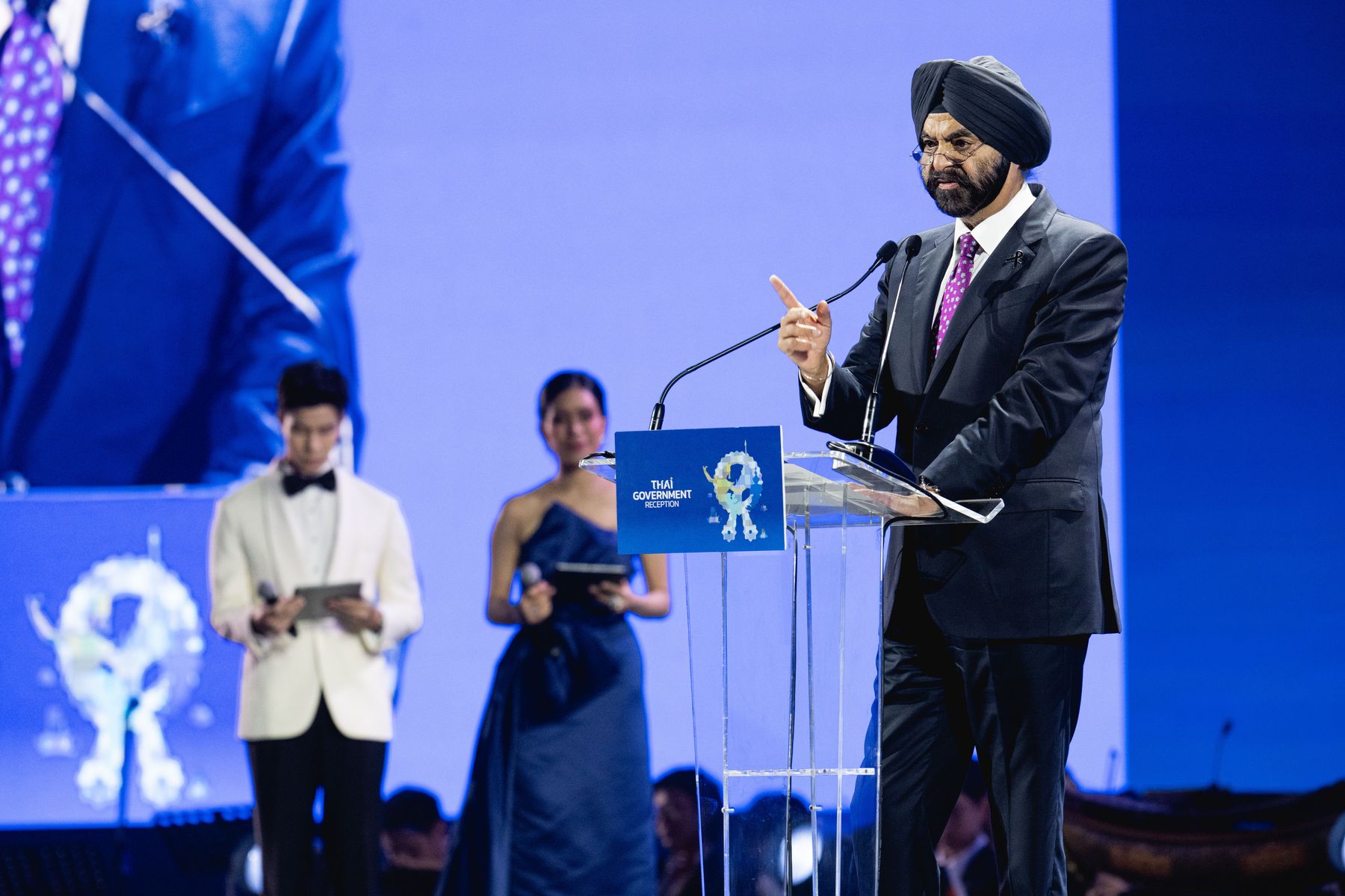 Bee Xoomsai on stage hosting the Thai Government Gala Reception as the World Bank Group President addresses delegates, Bangkok 2026